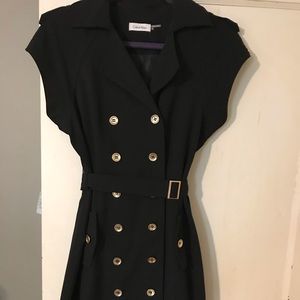Calvin Klein black dress with gold button detail.